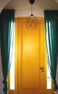 home-interior-bright-yellow-front-door-and-green-2022-11-16-11-18-41-utc